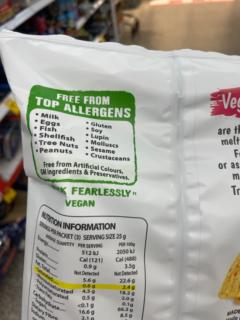 Packaging of a vegan snack highlighting that it is free from top allergens including milk, eggs, fish, shellfish, tree nuts, peanuts, gluten, soy, and more. Contains nutritional information for serving size and ingredients.